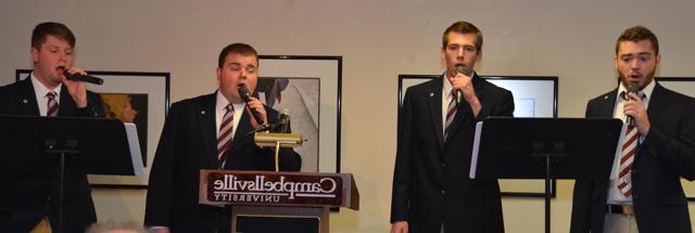 CU Sound performs at the Campbellsville/Taylor County Chamber of Commerce luncheon.  Members are from left: Blake Whitlock of Hodgenville, Ky.; Jeremy Bell of Harlan, Ky.; Jericho McCoy of Campbellsville, Ky., and Andrew Butler of Vine Grove, Ky. Seth Hayes of Leitchfield,  Ky., plays piano for the group. (Campbellsville University Photo by Drew Tucker)