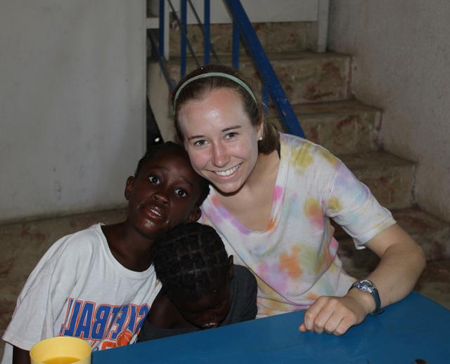 Savannah Workman hugs some children in Neply, Haiti during her mission trip.