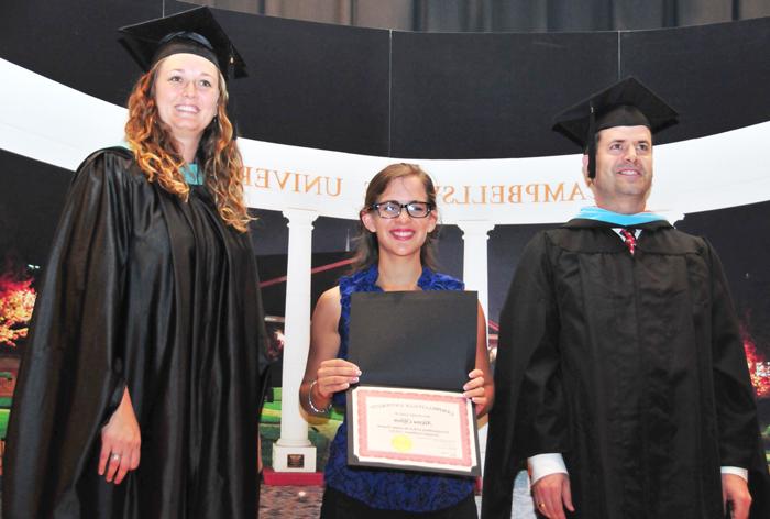 Alayna Clifton of Tomball, Texas, second from left, receives the Summer Program Activities Coordinator Award by, from left: Timothy Hooker, ESL program director and instructor in ESL and Andrea Giordano, executive director for ESL, TESL, MATESOL and instructor for ESL, TESL and MATESOL. (Campbellsville University photo by Joshua Williams)