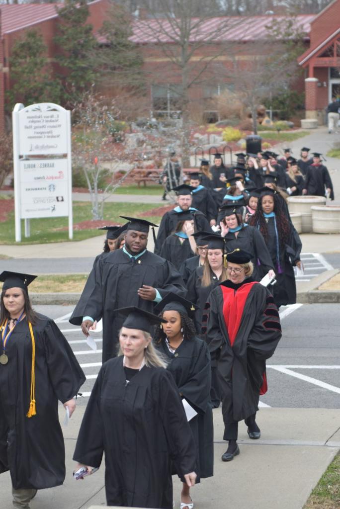 A tradition, the graduate walk, takes place from Davenport Student Commons as Dr. Helen Mudd, dean of the Carver School of Social Work, was among the faculty walking. (Campbellsville University Photo by Andrea Burnside)